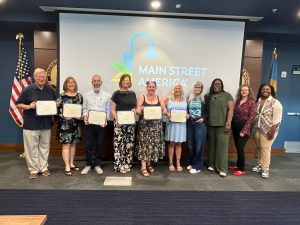 Delaware Main Street Coordinators displaying certifications
